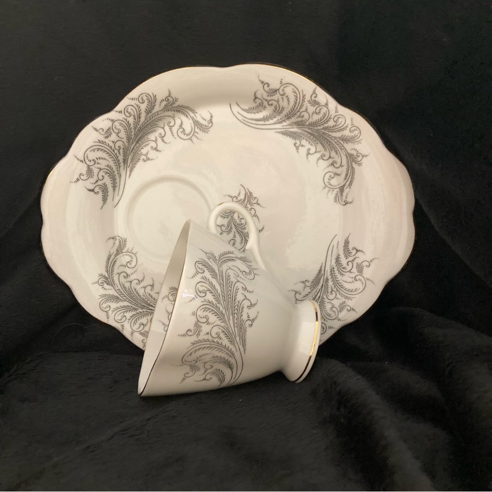 Windsor China teacup and cake plate with grey floral pattern and gold trim.